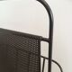 Black lacquered metal and perforated metal magazine rack designed by Mathieu Matégot 50.