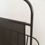 Black lacquered metal and perforated metal magazine rack designed by Mathieu Matégot 50.