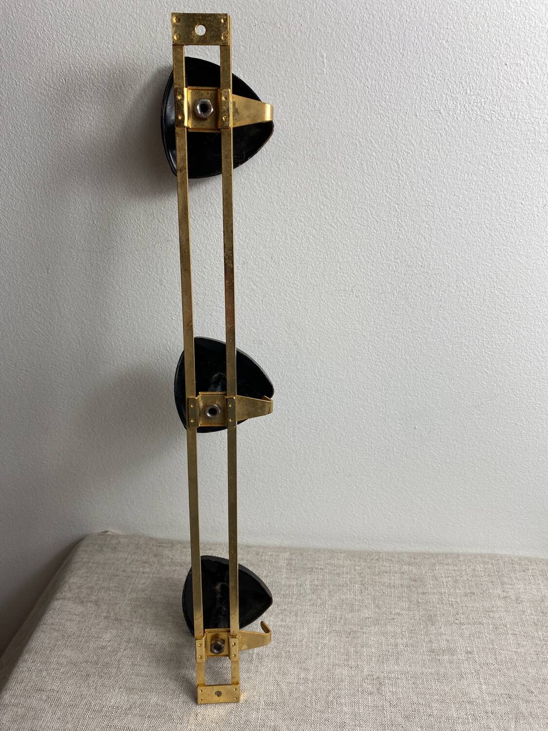 Wall-mounted coat rack with 3 hooks from the 1960s.