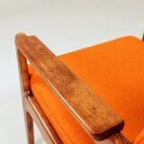 Vintage armchair in papaya orange wool from the 1960s.