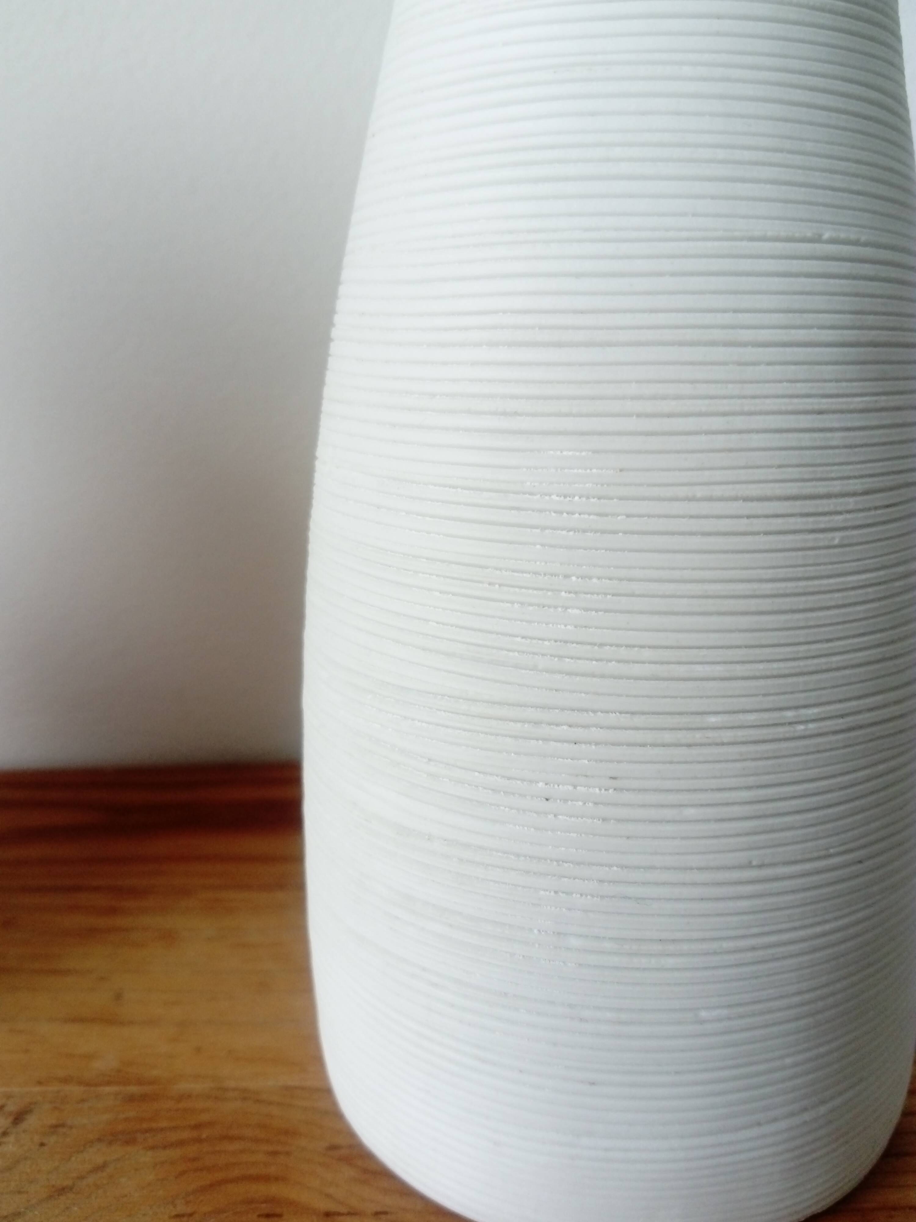 White ceramic vase with fine streaks