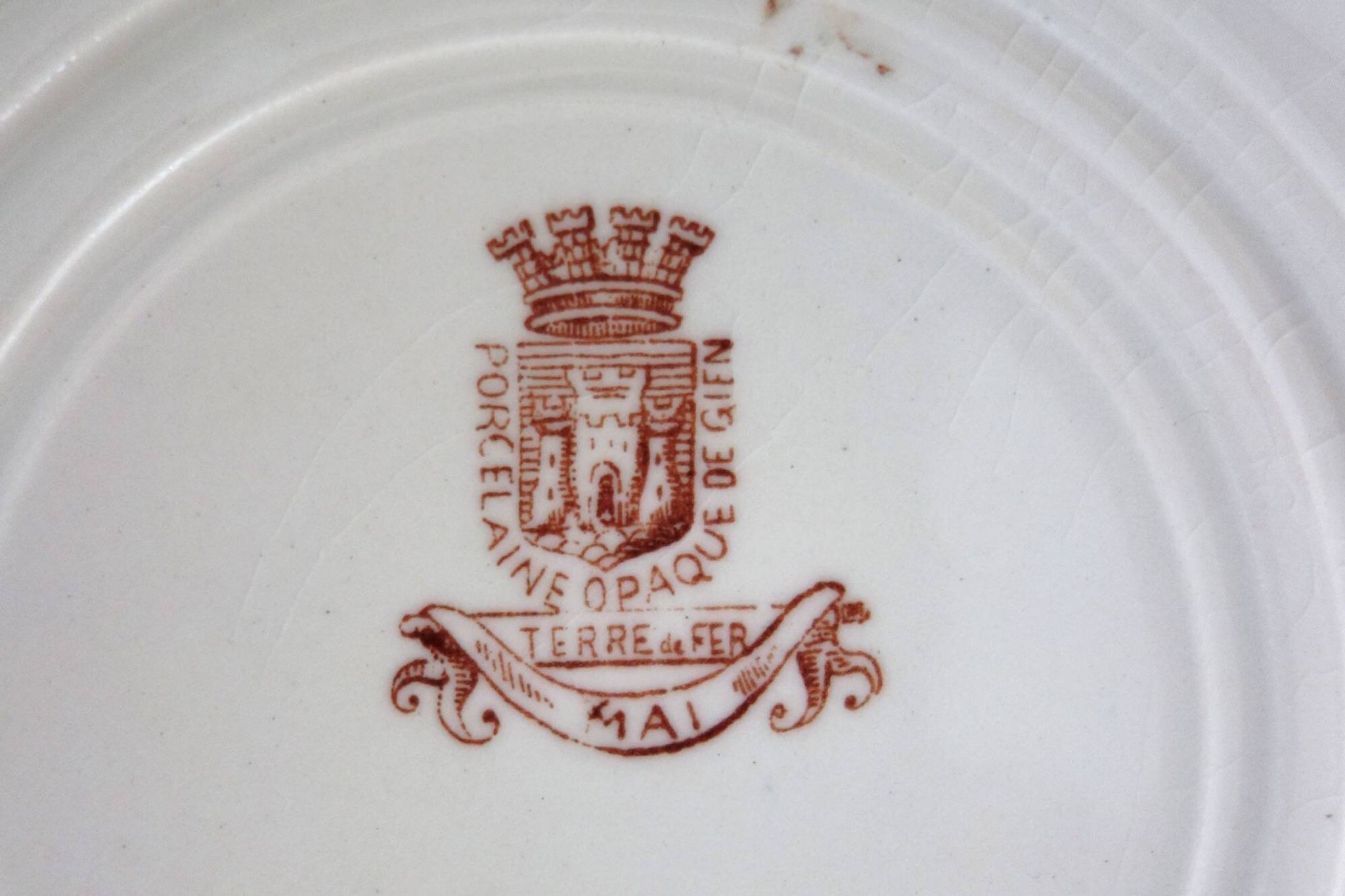 11 deep plates Terre De Fer Gien model Mai circa 1900