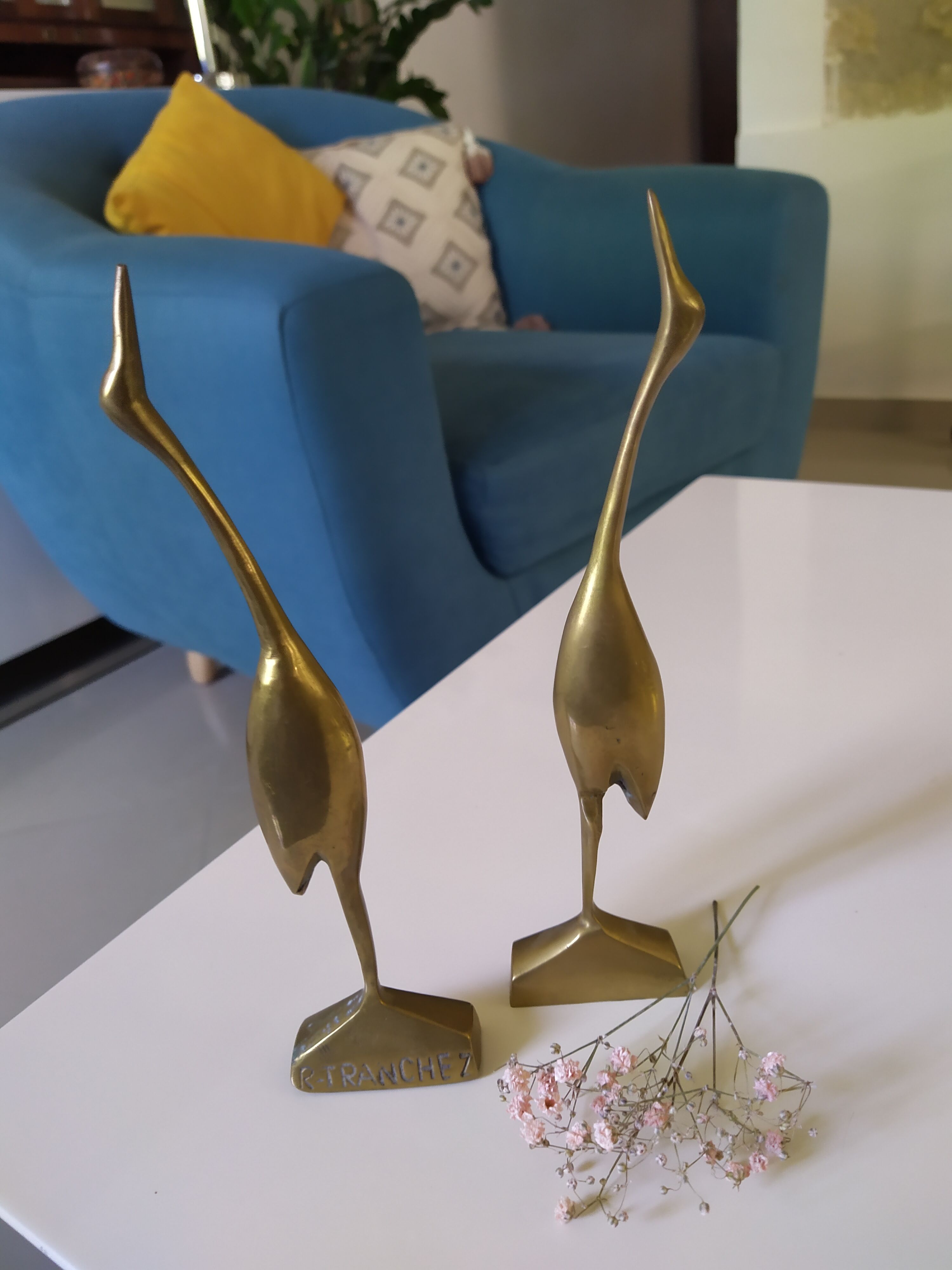 Coupled with brass herons