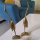 Coupled with brass herons