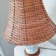 Ceramic lamp with rattan lampshade.