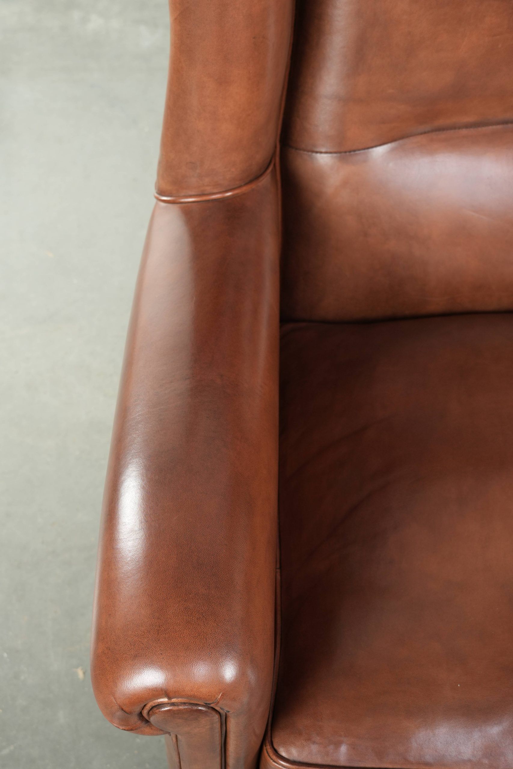 Large sheepskin wingback armchair in timeless English style