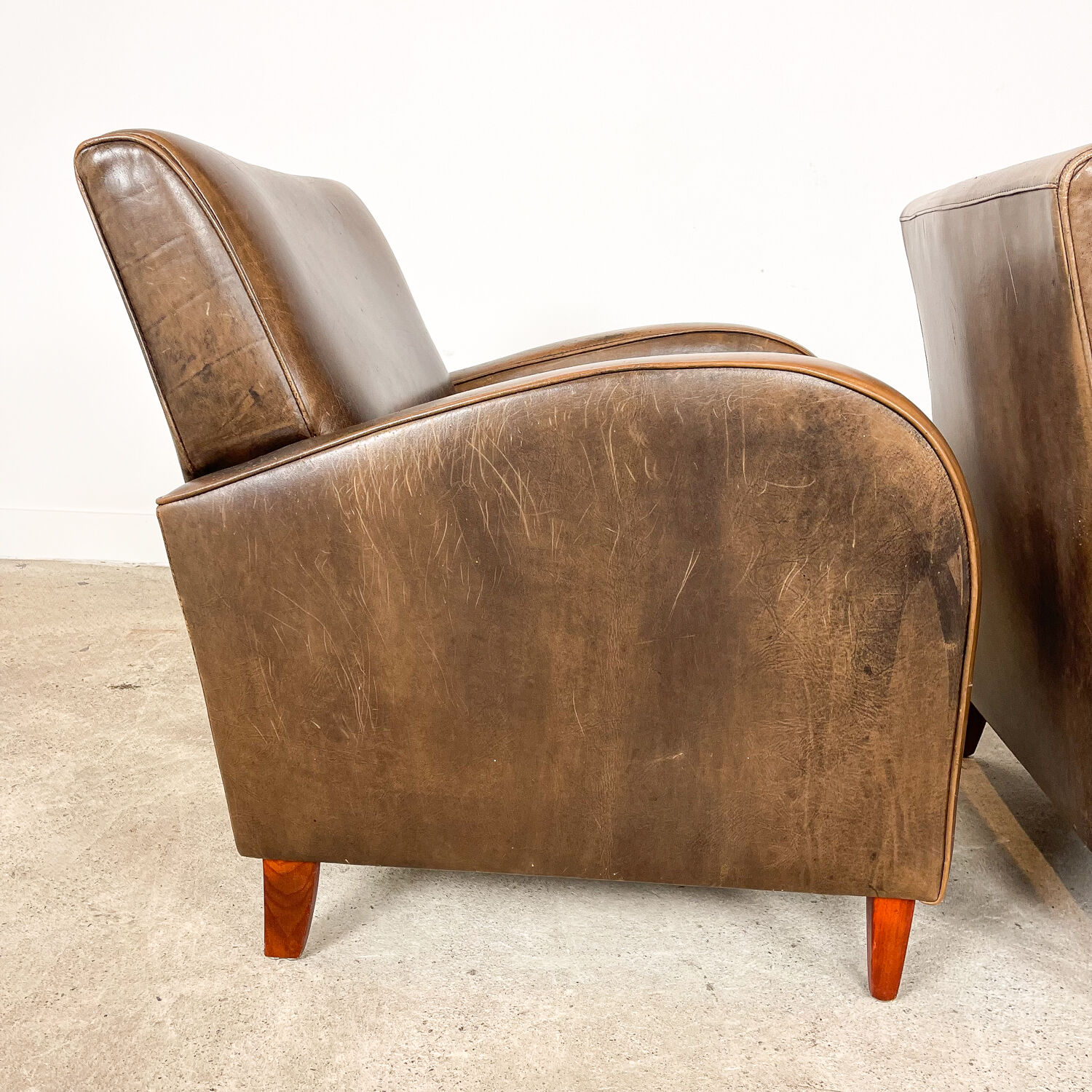 Set of two vintage leather wagon wheel armchairs Haarle