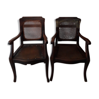 Pair of wooden and cane barber chairs