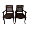 Pair of wooden and cane barber chairs