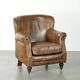 Robust cowhide armchair in a beautifully subtle size with a wonderful patina.