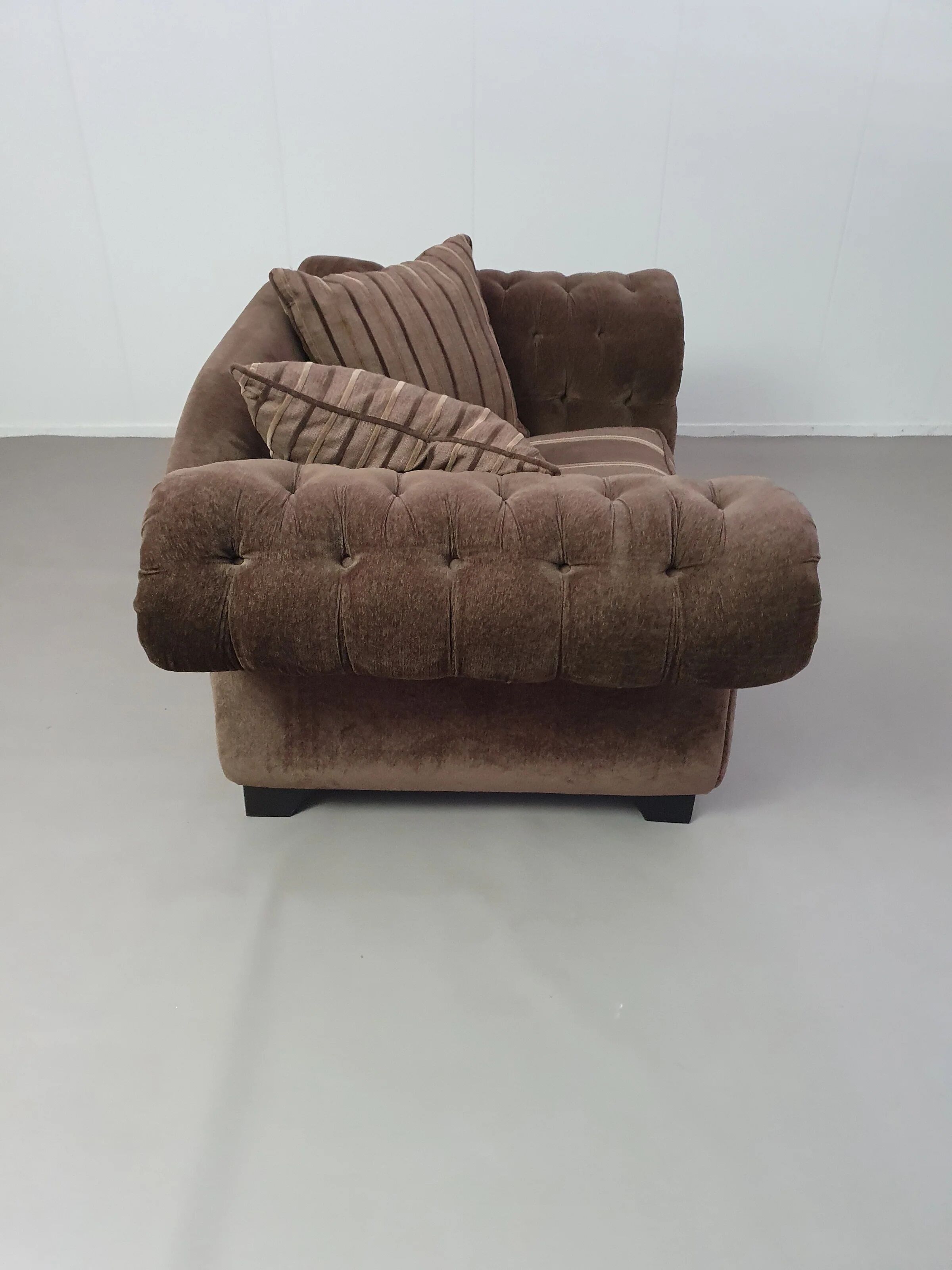 Large weighty love seat with the original matching cushions. Marked "Handmade in Holland"