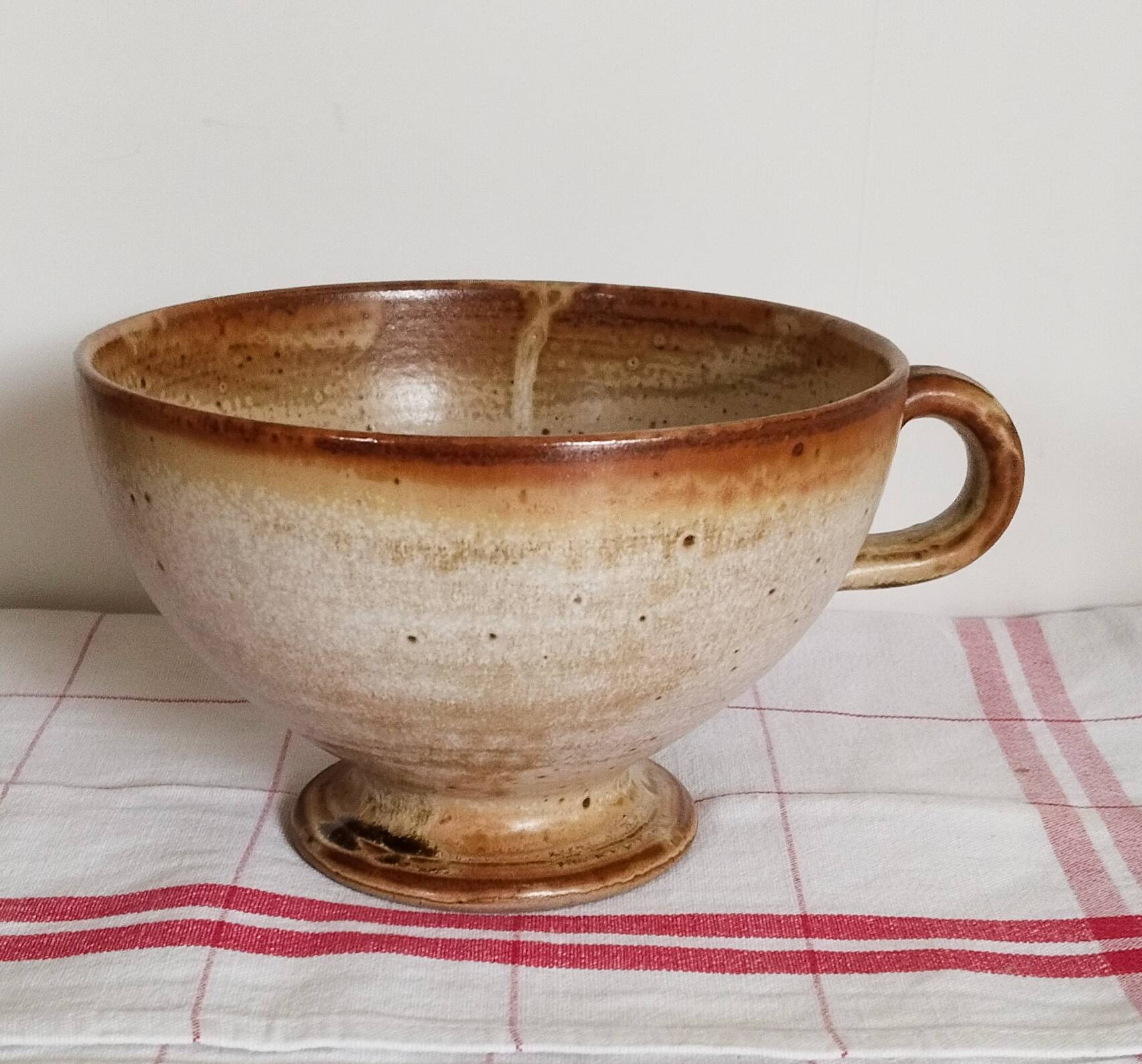 Large handmade stoneware bowl with foot