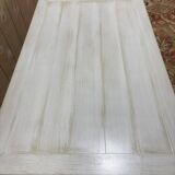 Painted wood coffee table with a distressed finish.