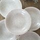 Beige speckled hollow plates