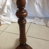 Round end table with tripod mast. 50 years. Medium oak color.
