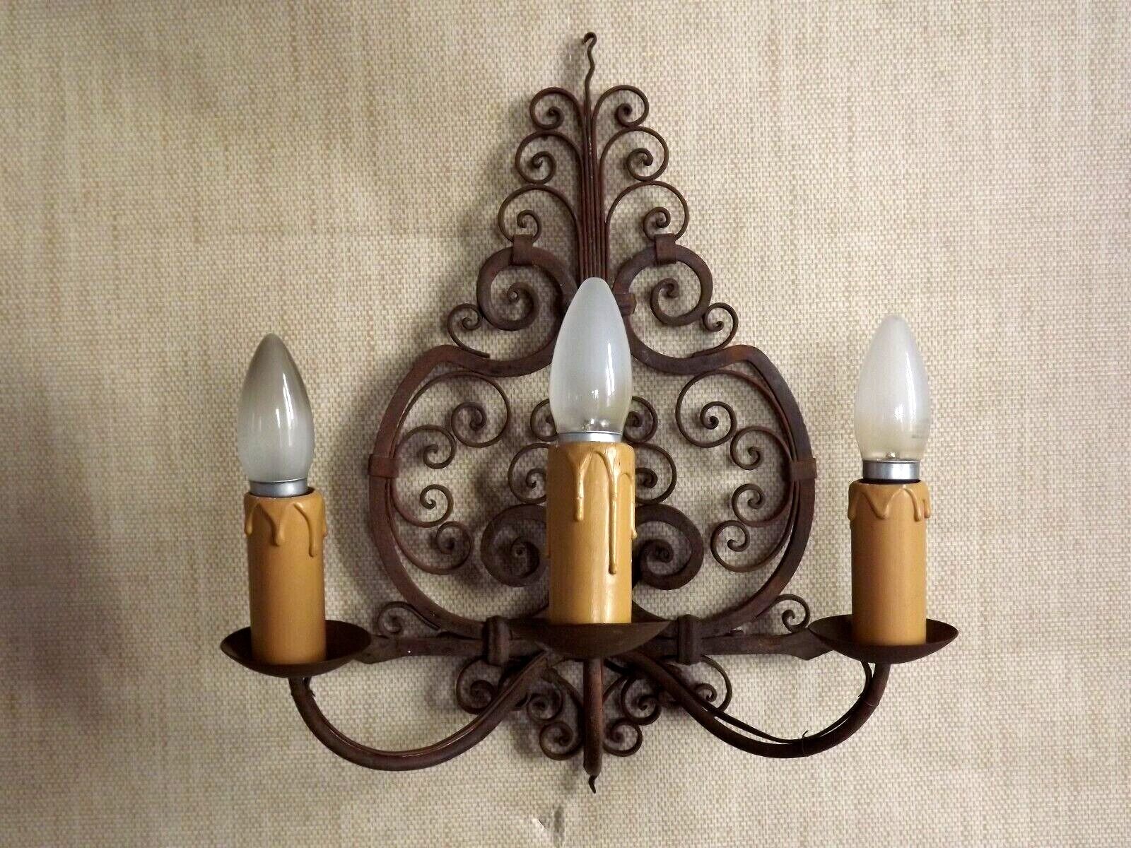 French triple wall sconce in wrought iron, early 20th century.
