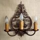French triple wall sconce in wrought iron, early 20th century.