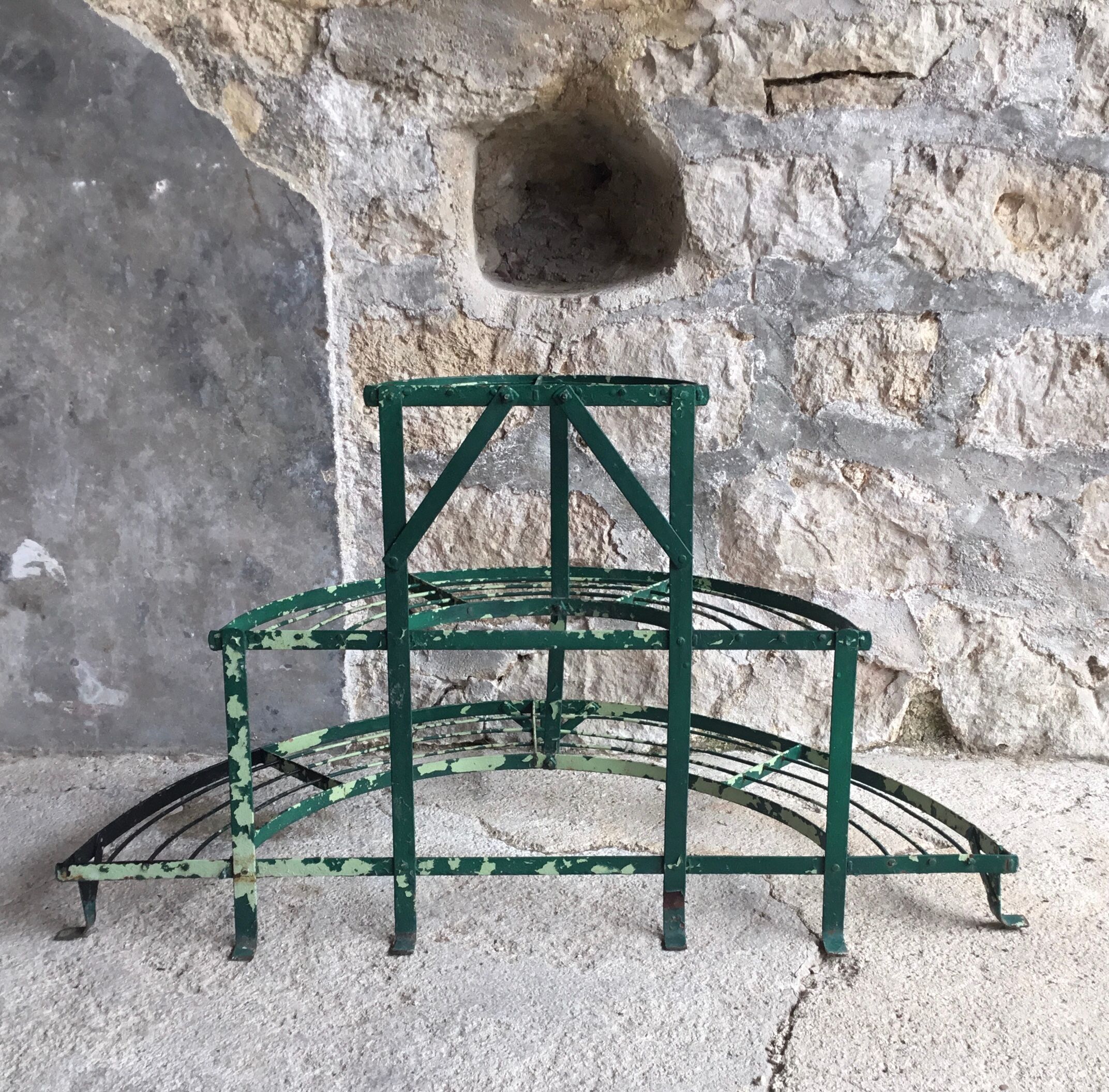 Antique half-moon metal plant stand