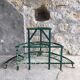 Antique half-moon metal plant stand