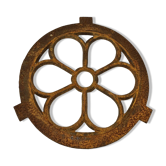 Ox's eye window in the shape of a cast iron flower