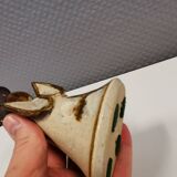 Ceramic candle holder, in the shape of an angel, signed at the bottom.