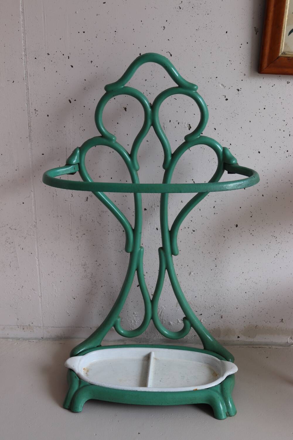 Old green cast iron umbrella stand