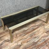 Design coffee table in gilded metal and tinted glass