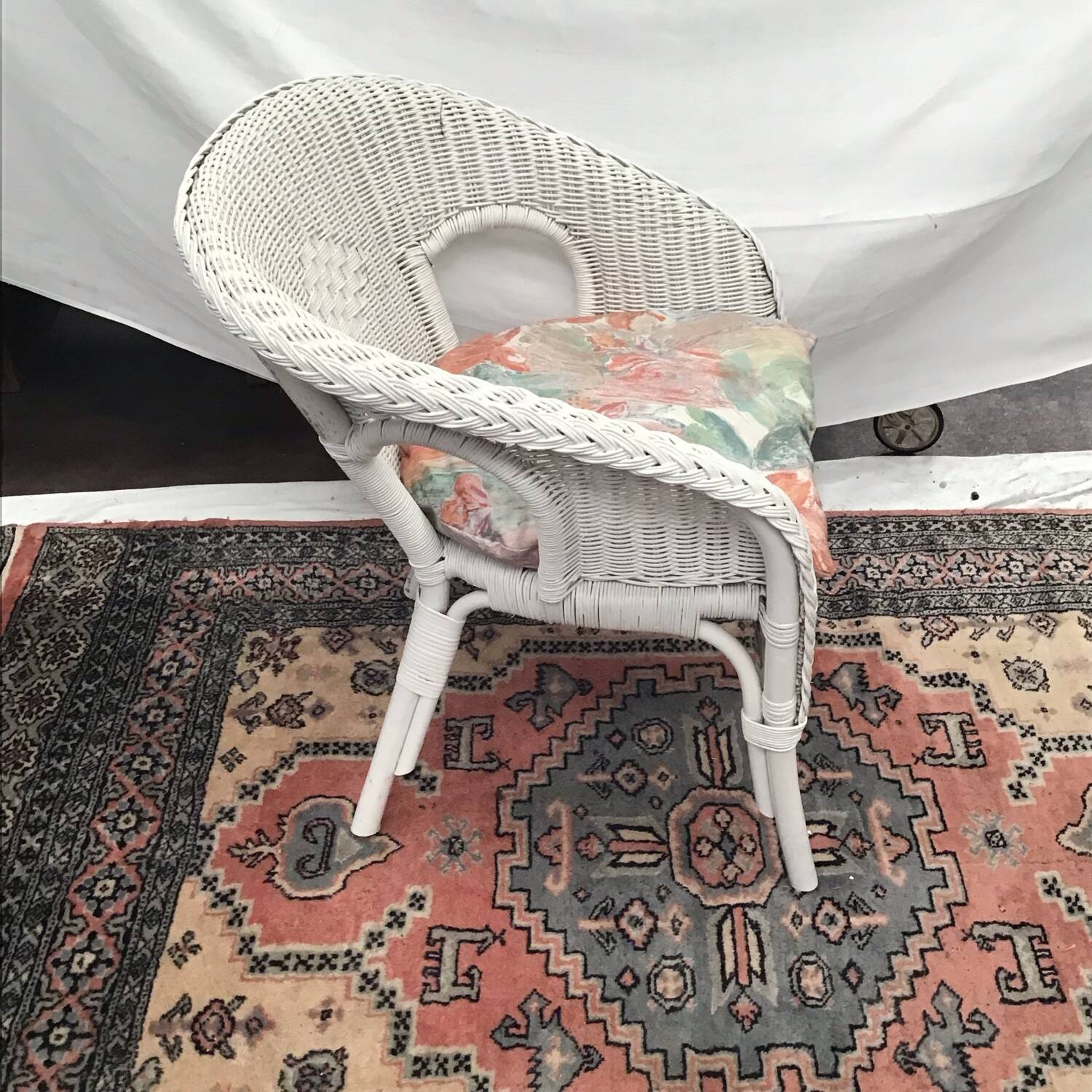 White rattan armchair with pretty vintage