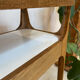 Small contemporary console in stained walnut wood.