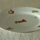 Oval dish in pâte and Limoges enamel decorated with four seasons vegetables.