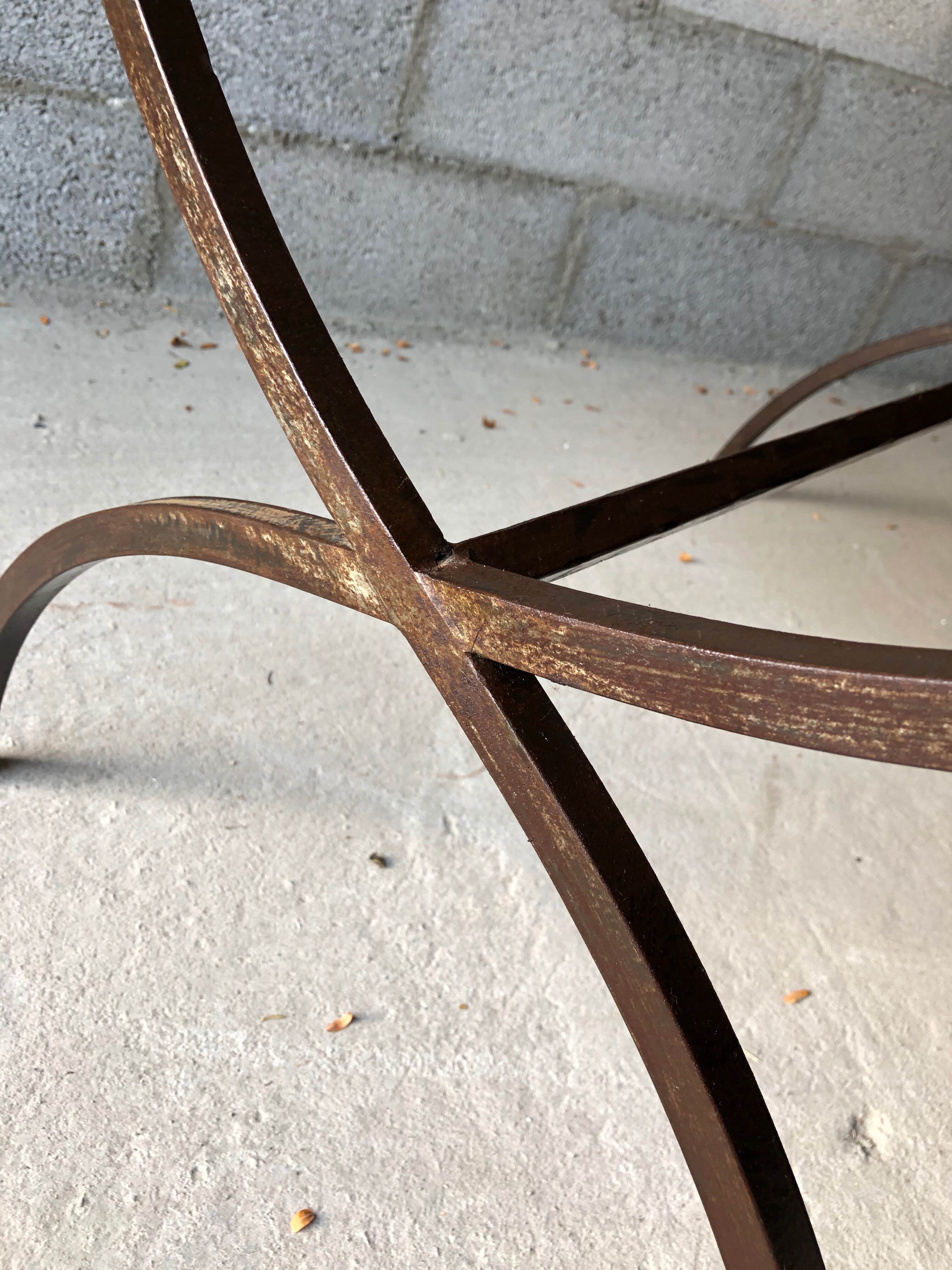 Table made of wrought iron and cement