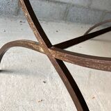 Table made of wrought iron and cement