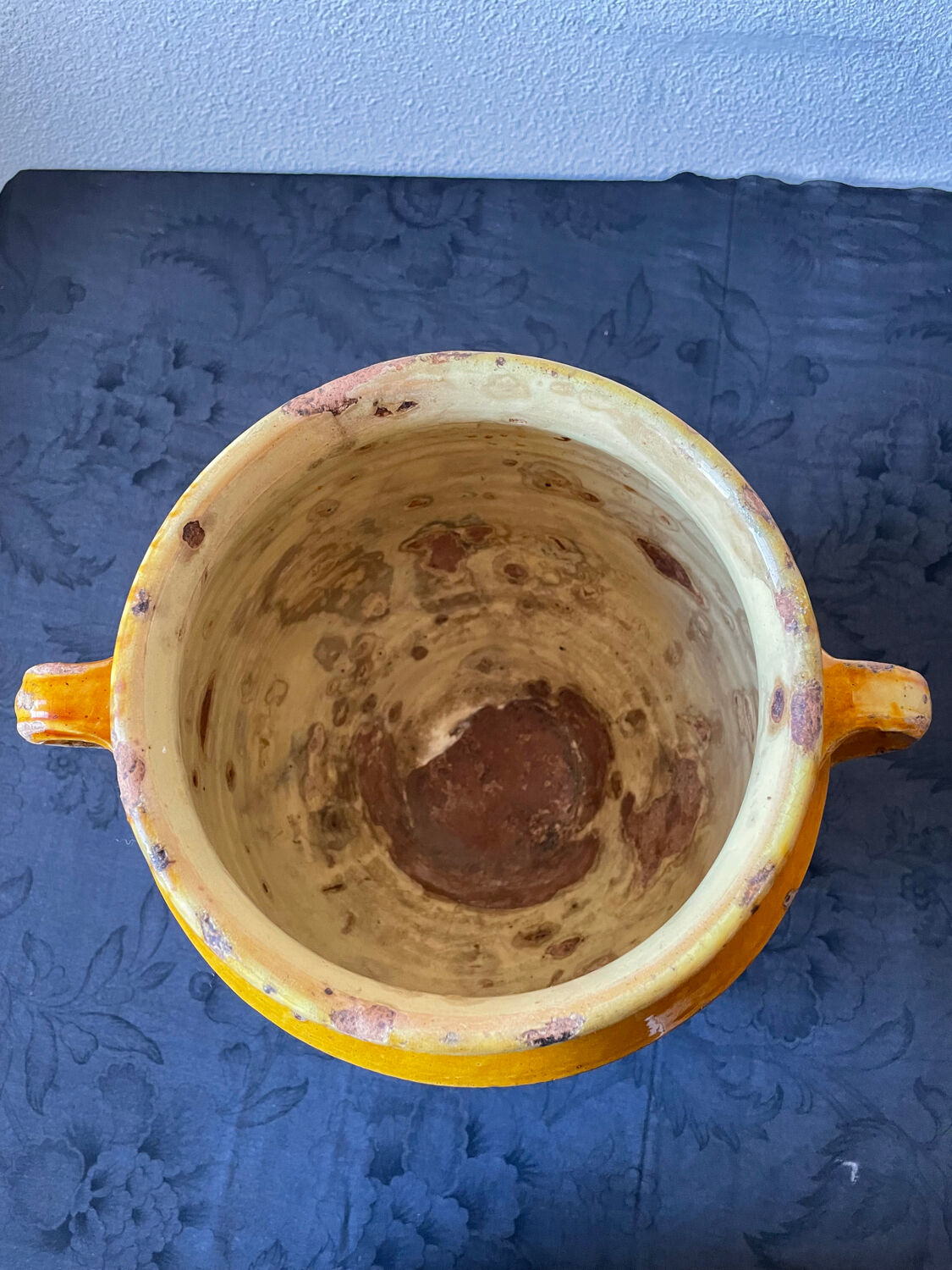 Old yellow glazed terracotta grease pot south west France