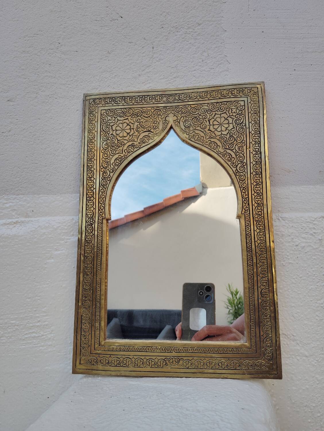 Golden oriental mirror