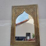 Golden oriental mirror