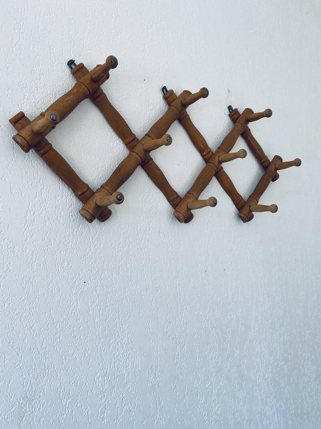 Old wooden wall coat rack