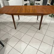 Large extendable Scandinavian table in vintage teak from the 1970s.