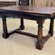 English monastery table with extensions from the late 19th century in elm and oak.