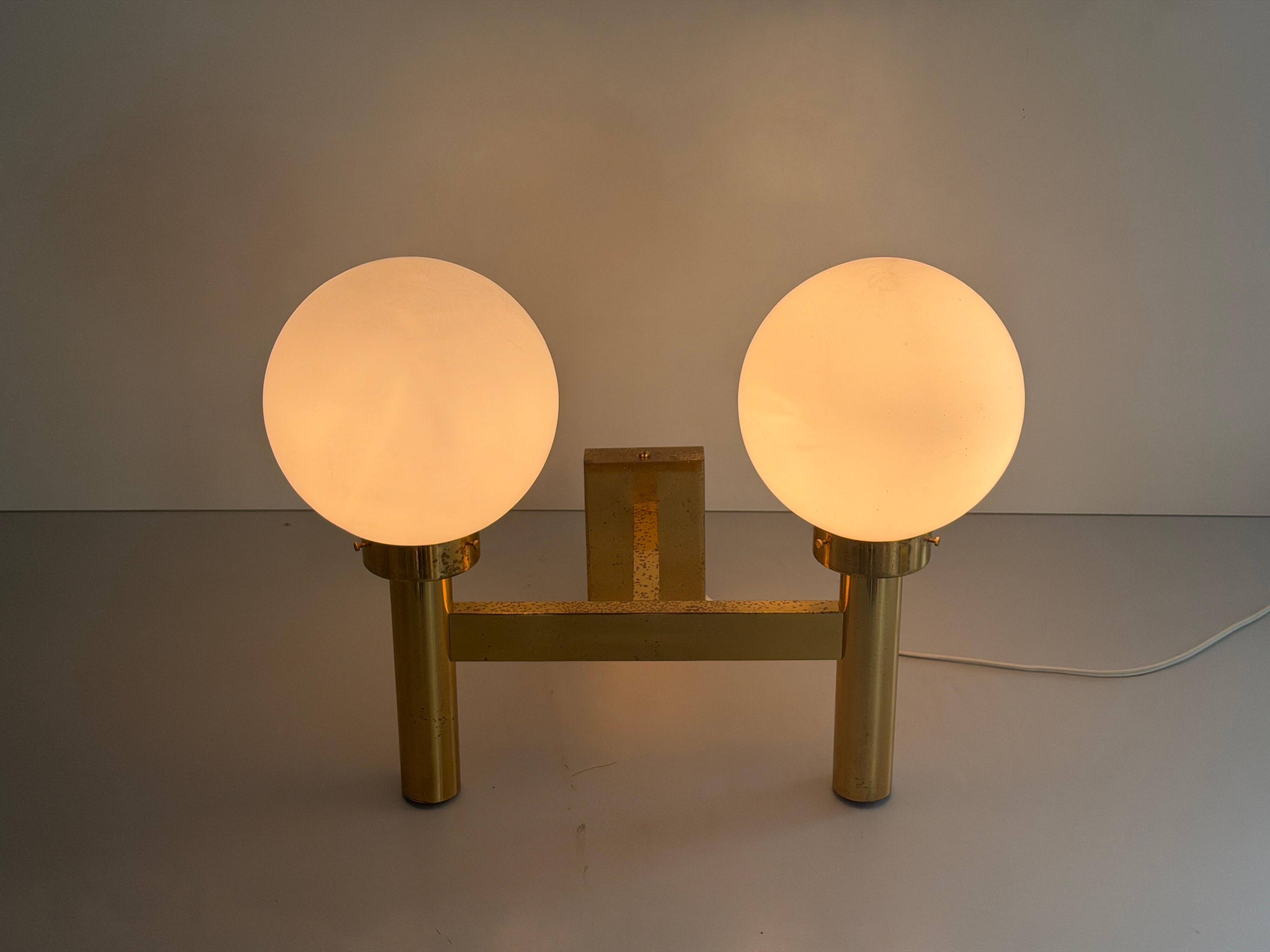 Double opal glass and heavy brass, large minimalist cinema wall light, 1960s, Germany