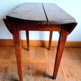 Antique round walnut table with flaps