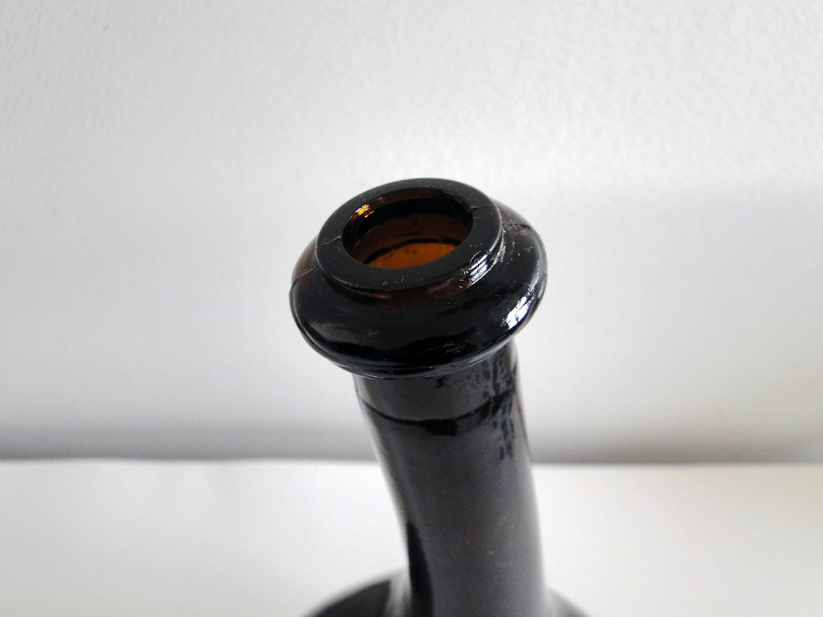 Old and original blown glass bottle with XXth bent neck