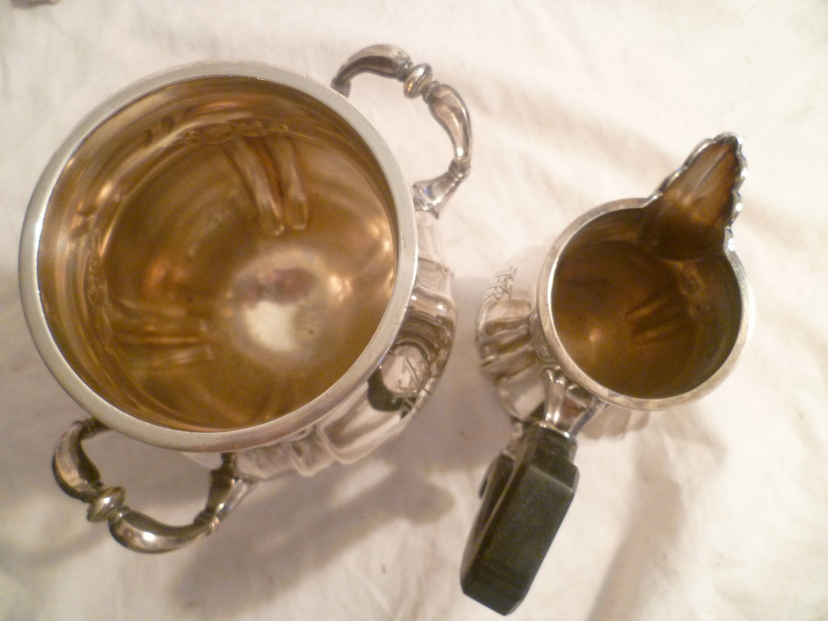 Sugar bowl & its milk pot with ebony handle in silver metal