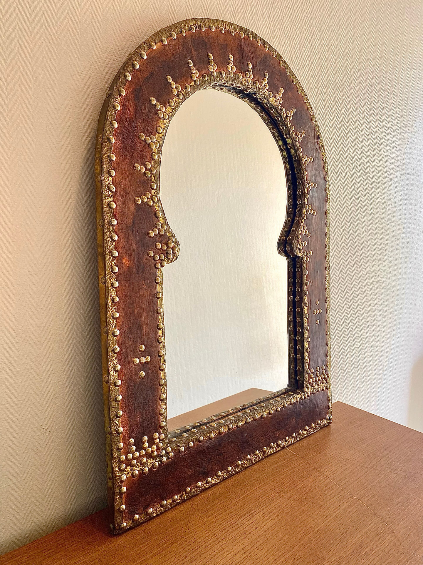Large vintage mirror in studded leather and brass