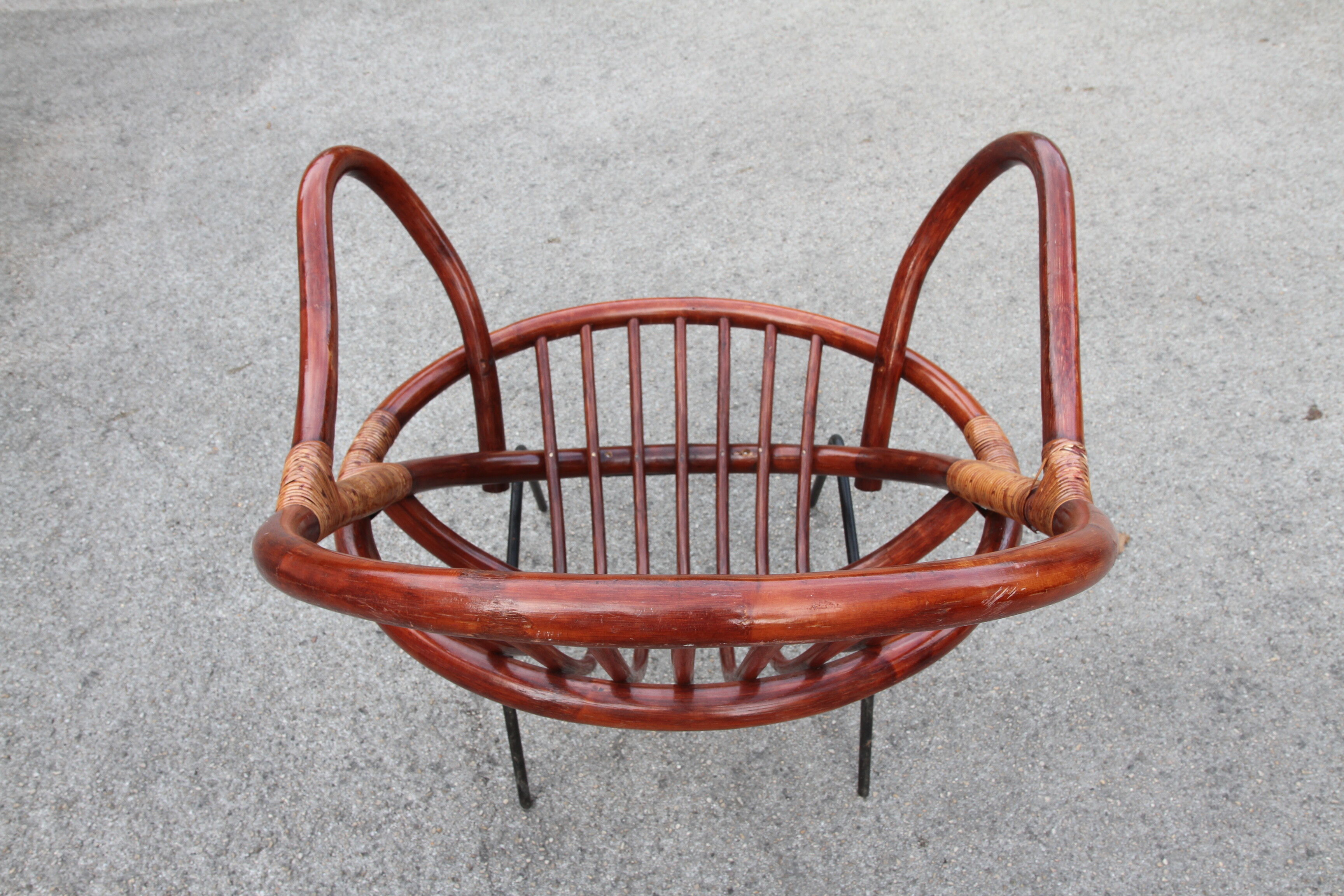Rattan shell armchair with metal feet
