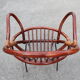 Rattan shell armchair with metal feet