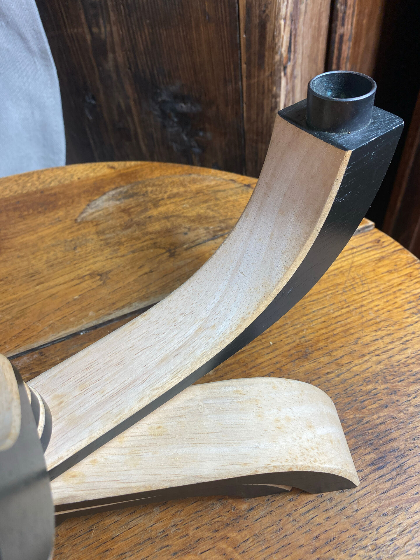 Foldable and deconstructed chandelier, minimalist Swedish design in wood.