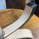 Foldable and deconstructed chandelier, minimalist Swedish design in wood.