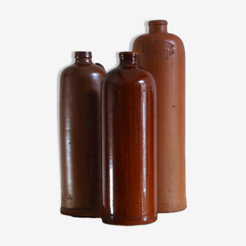 3 stoneware bottles