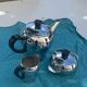 Coffee service consisting of three pieces in chrome and bakelite vintage