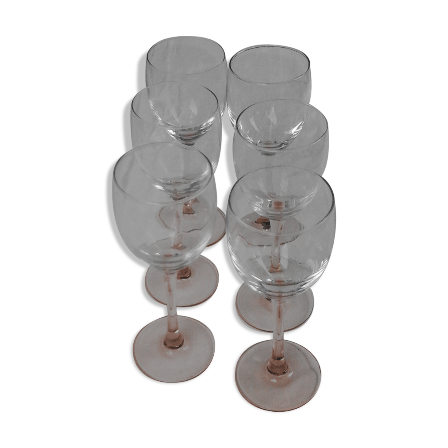 6 glasss of wine on pink foot